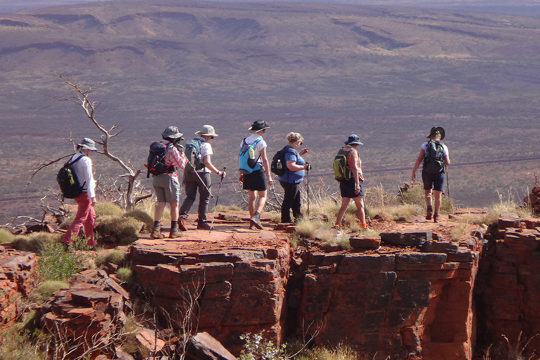 Group hiking in Karijini NP, Western Australia