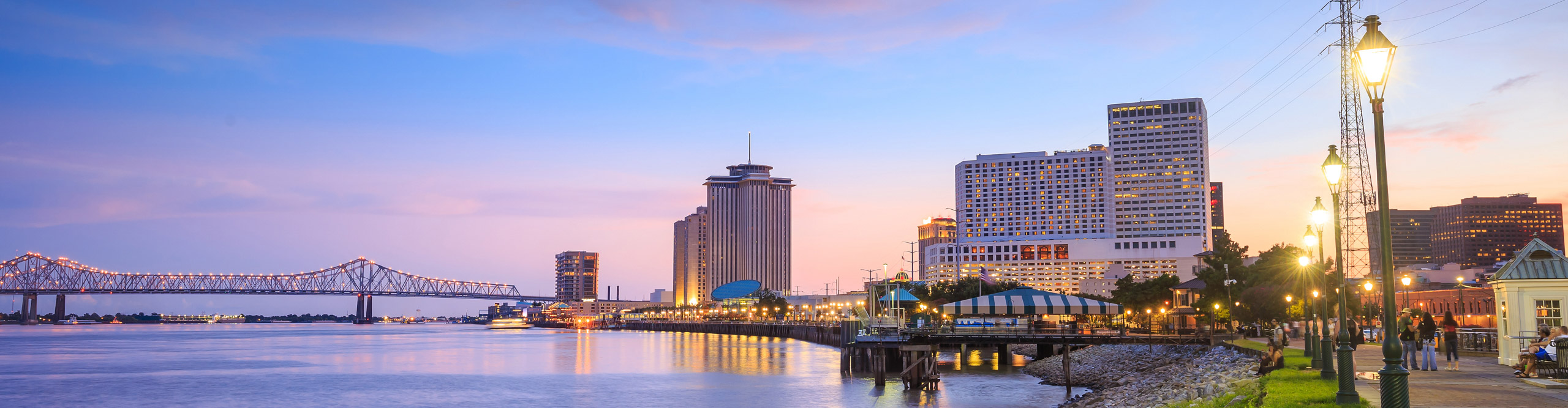 A pink and blue sky at dusk over the skyline of New Orleans, Lousiana, USA