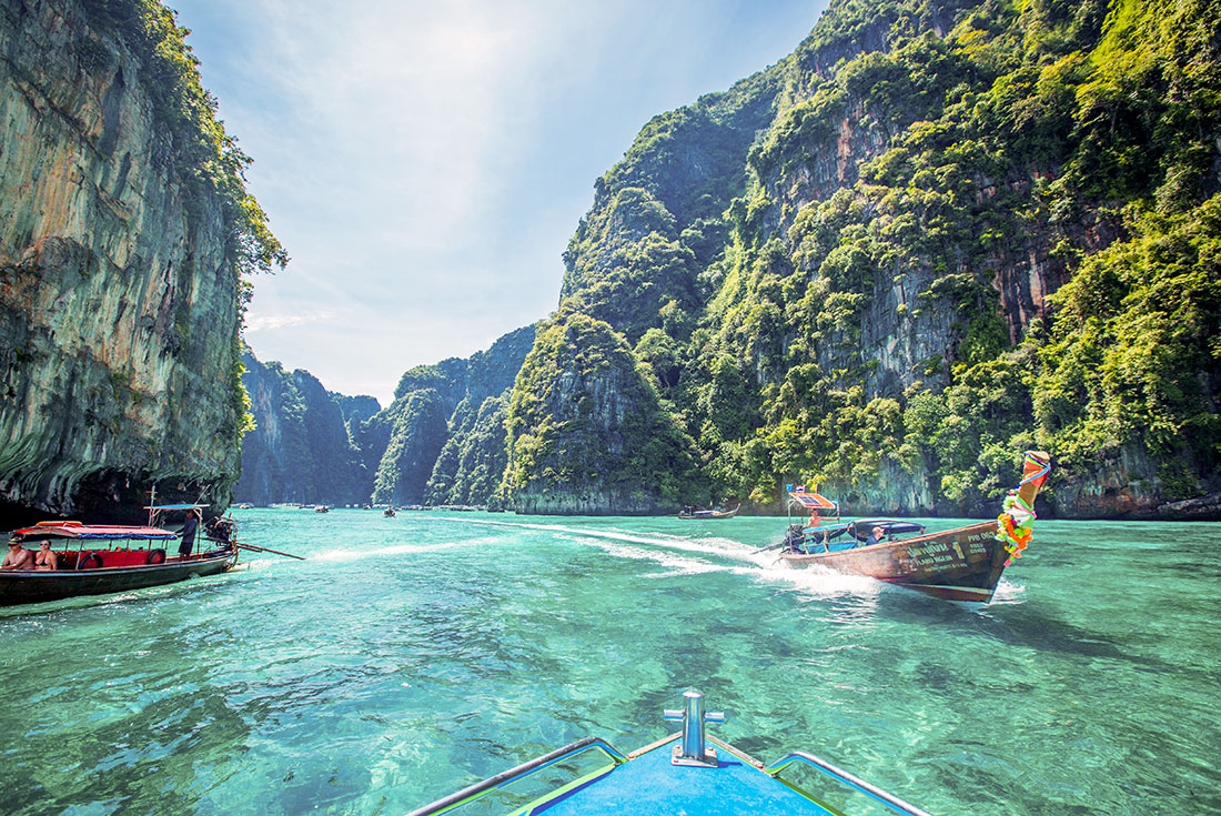 Roading a boat into the picturesque Phi Phi Islands