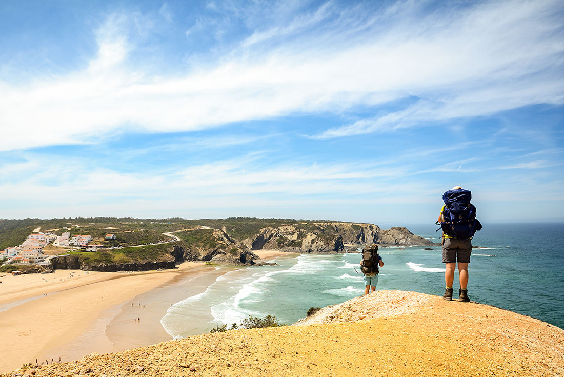 Hikers walking along Rota Vicentina coastline, Portugal
