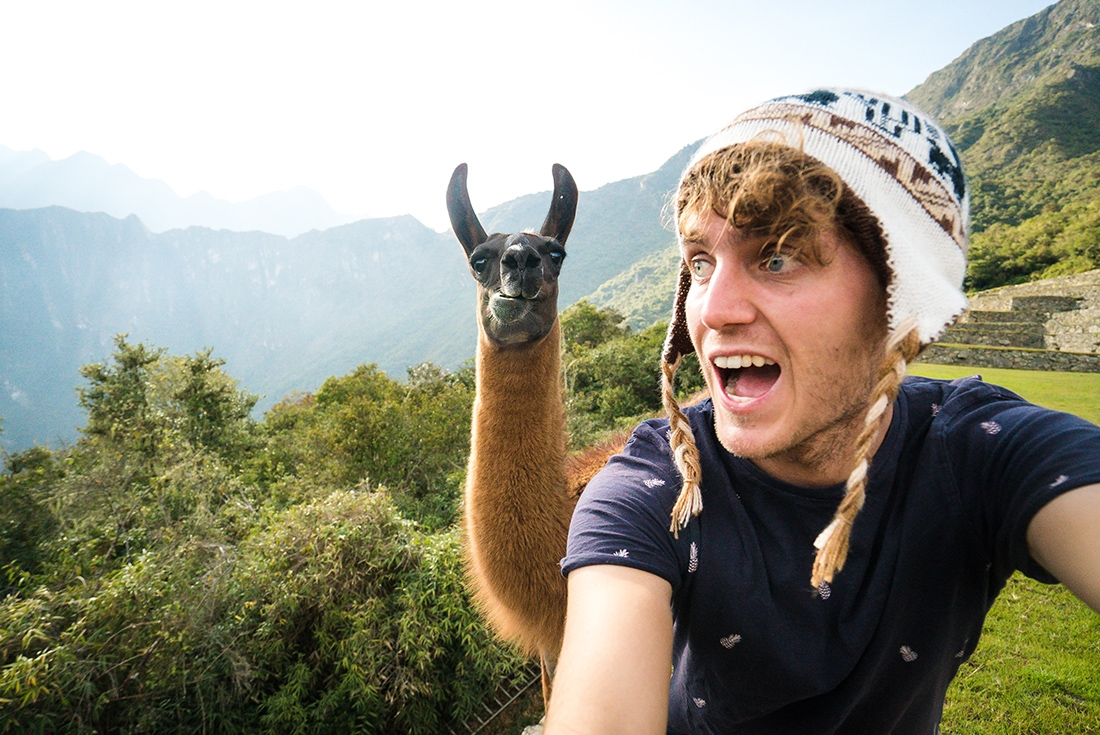 GSAI-essential-peru-machu-picchu-llama-selfie-traveller