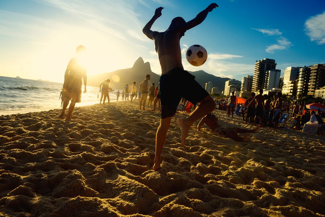 Watch the locals enjoy the a game of soccer on Copacabana beach
