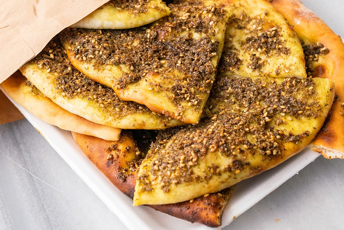 Try some of the amazing street food in Amman - such as Za’atar on bread