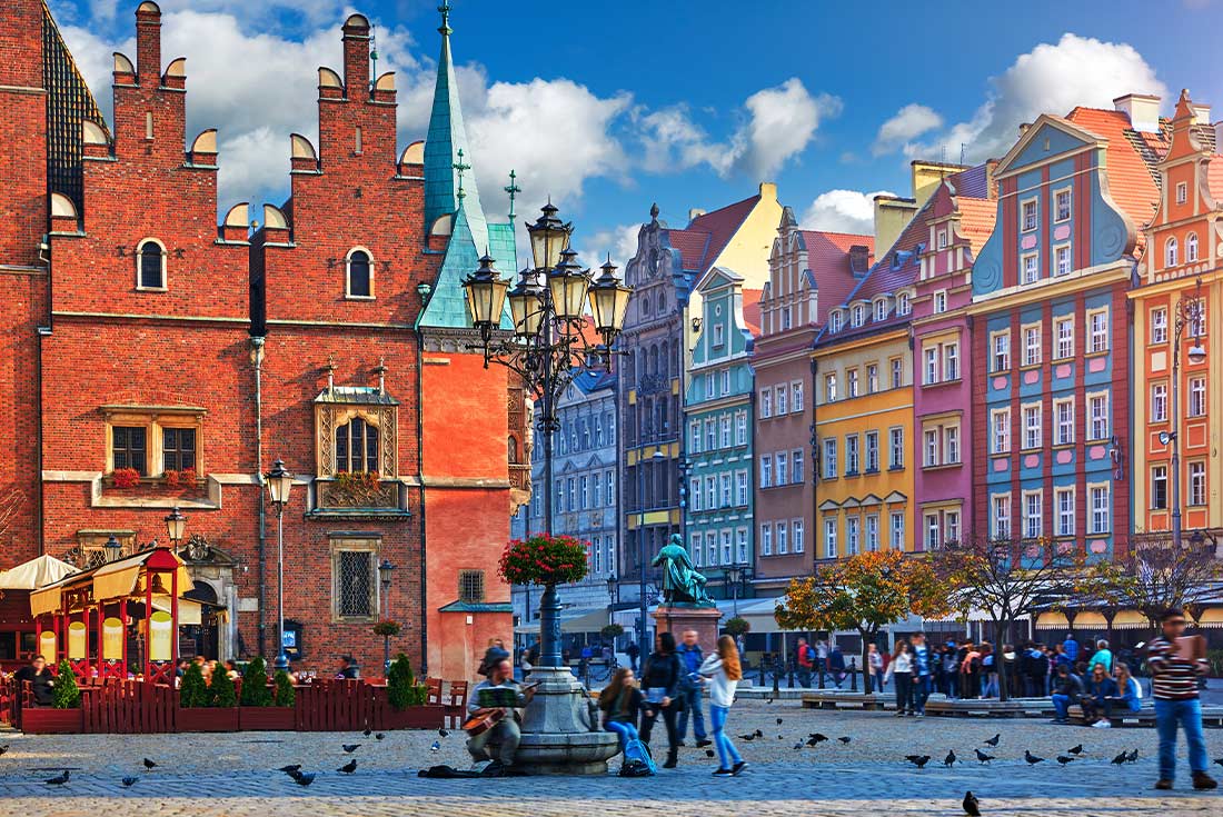The colourful streets and buildings of Wroclaw, Poland and people walking