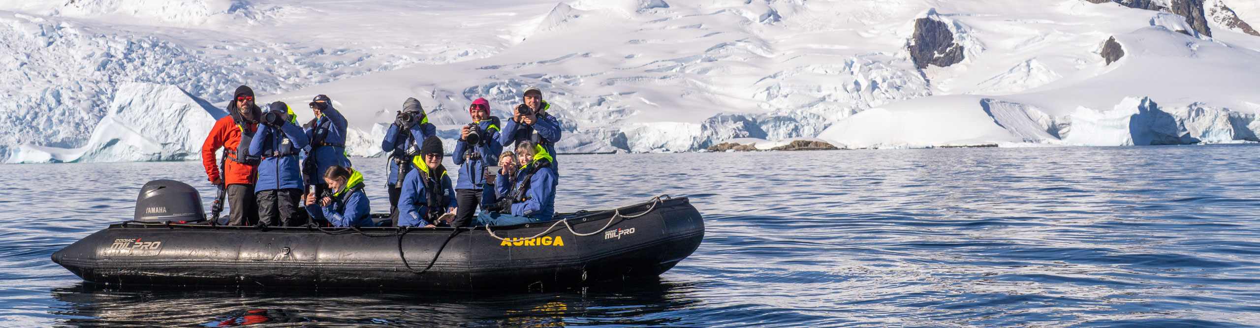 Group on kodiak taking photos in Antarctica