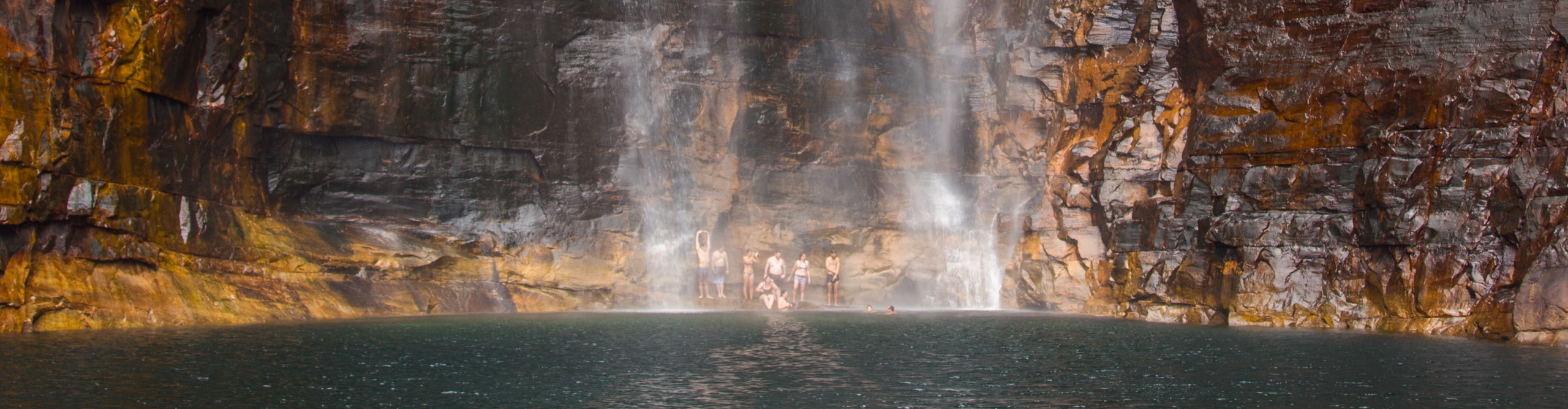 Group swimming at Jim Jim Falls, Kadadu, Northern Territory, Australia 