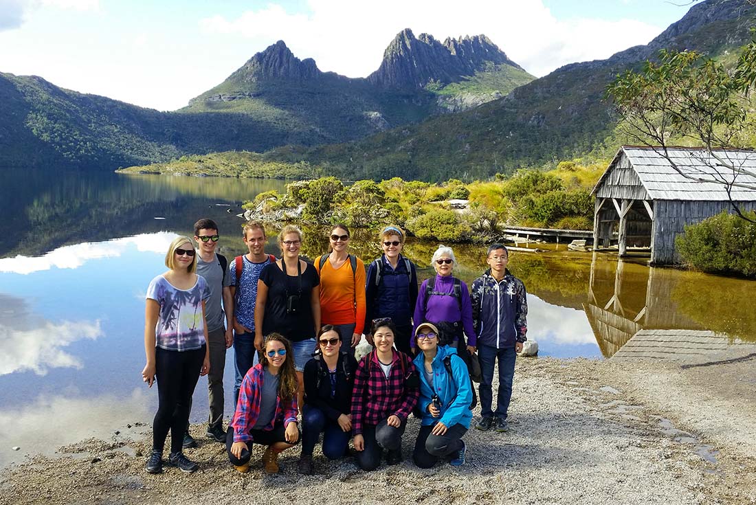 Group of hikers standing in front of Cradle Mountain