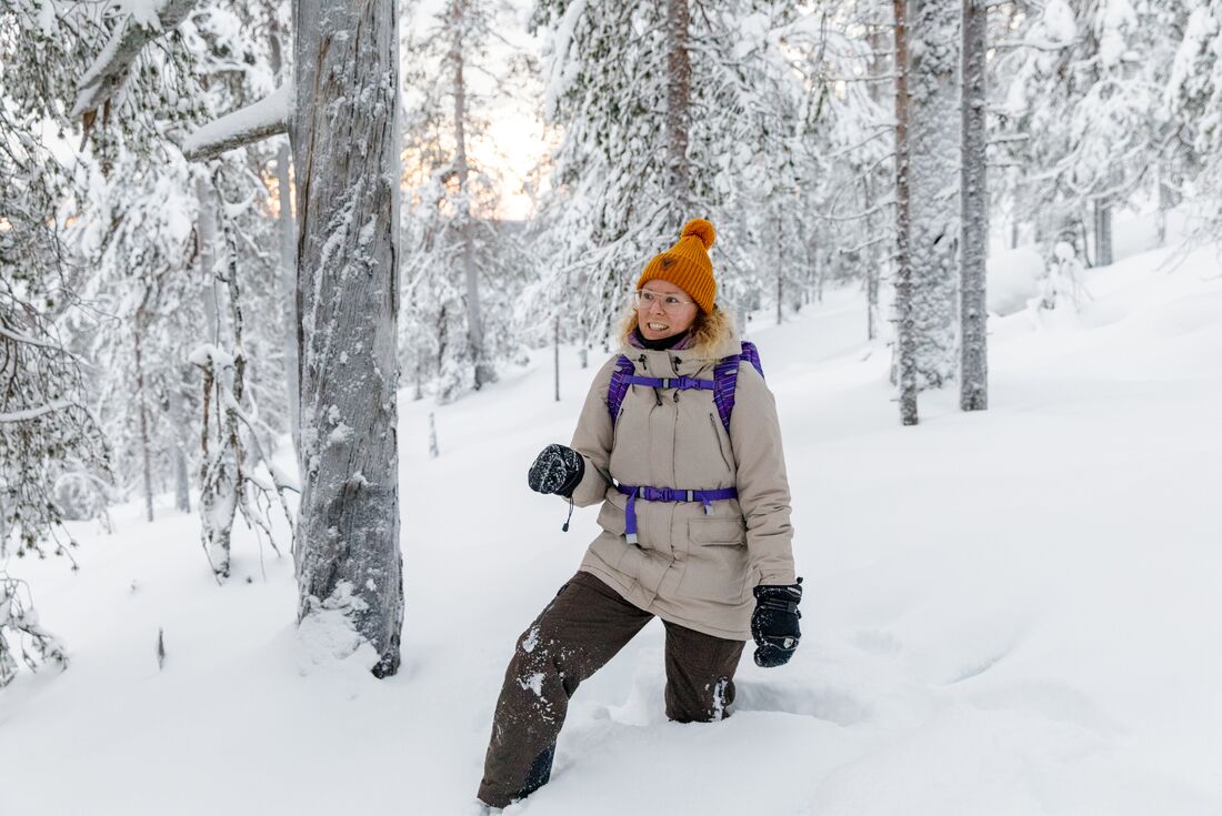 Guide walks through snow in Finland