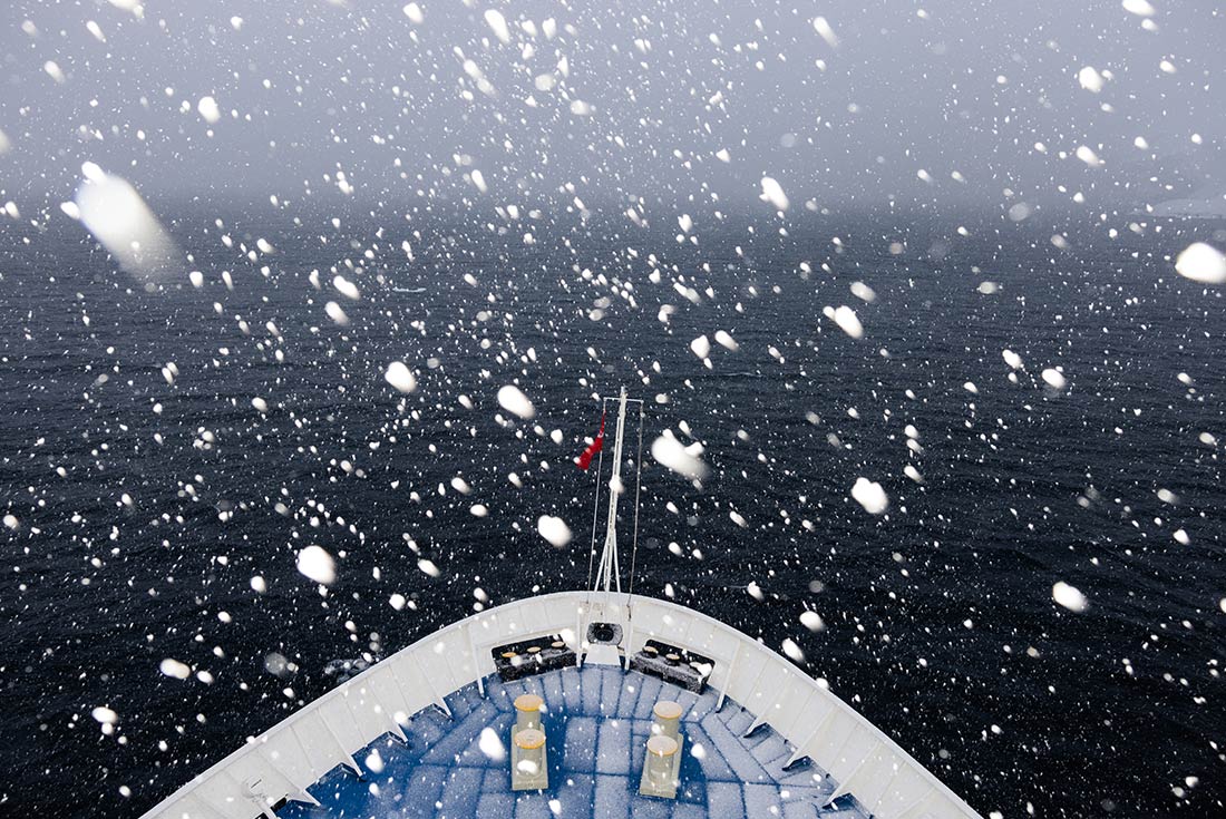 Fluffy snow off the bow of Ocean Endeavour, Antarctica