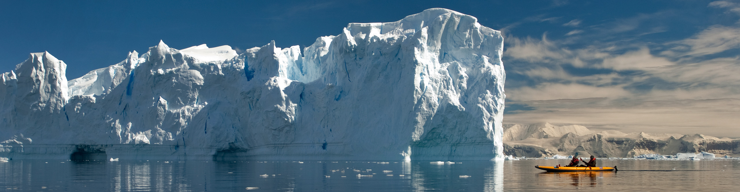 Kayaker in Neko Harbour on the Antarctic peninsula, in front of icebergs Neko is part of Andvord Bay