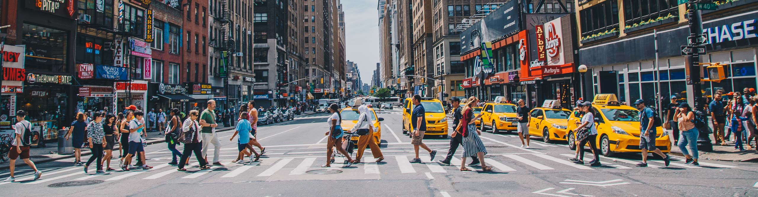 People crossing busy New York street