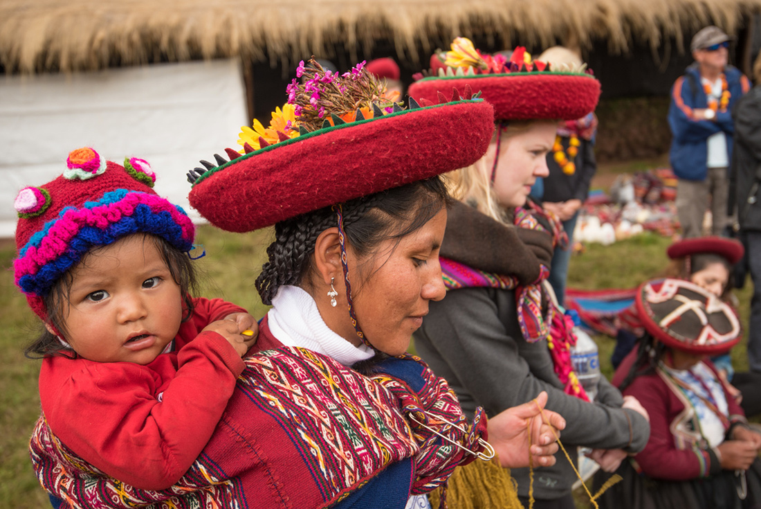 Local mother and child in traditional dress, Sacred Valley community visit, Peru