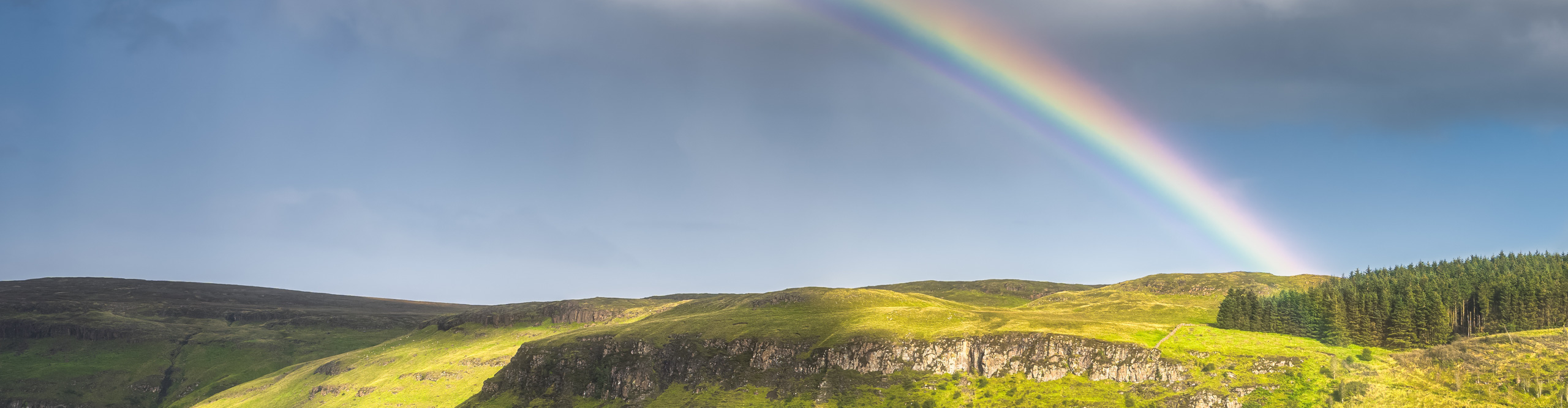Rainbow ove hills in Ireland 