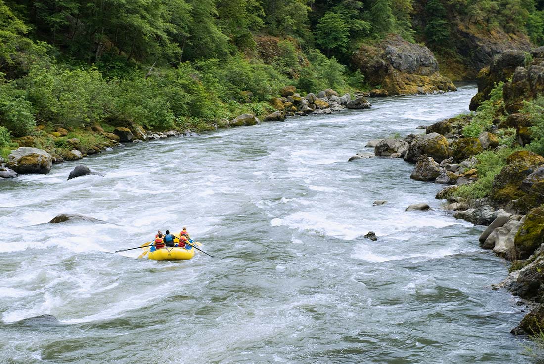 Group of travellers rafting along Flathead River in Montana, U.S.A.