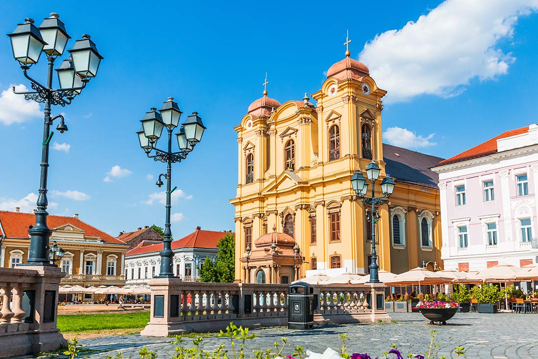 Colourful buildings and Union Square of Timisoara Village, Romania