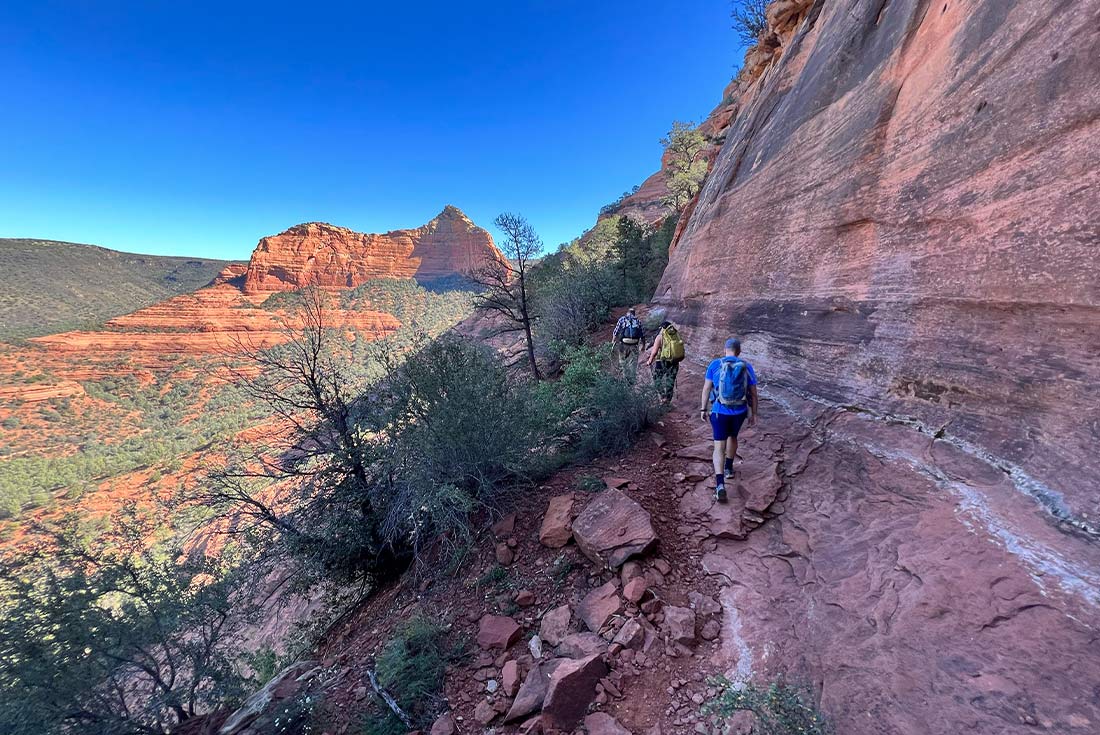 Travellers hiking on trail in Sedona, Arizona