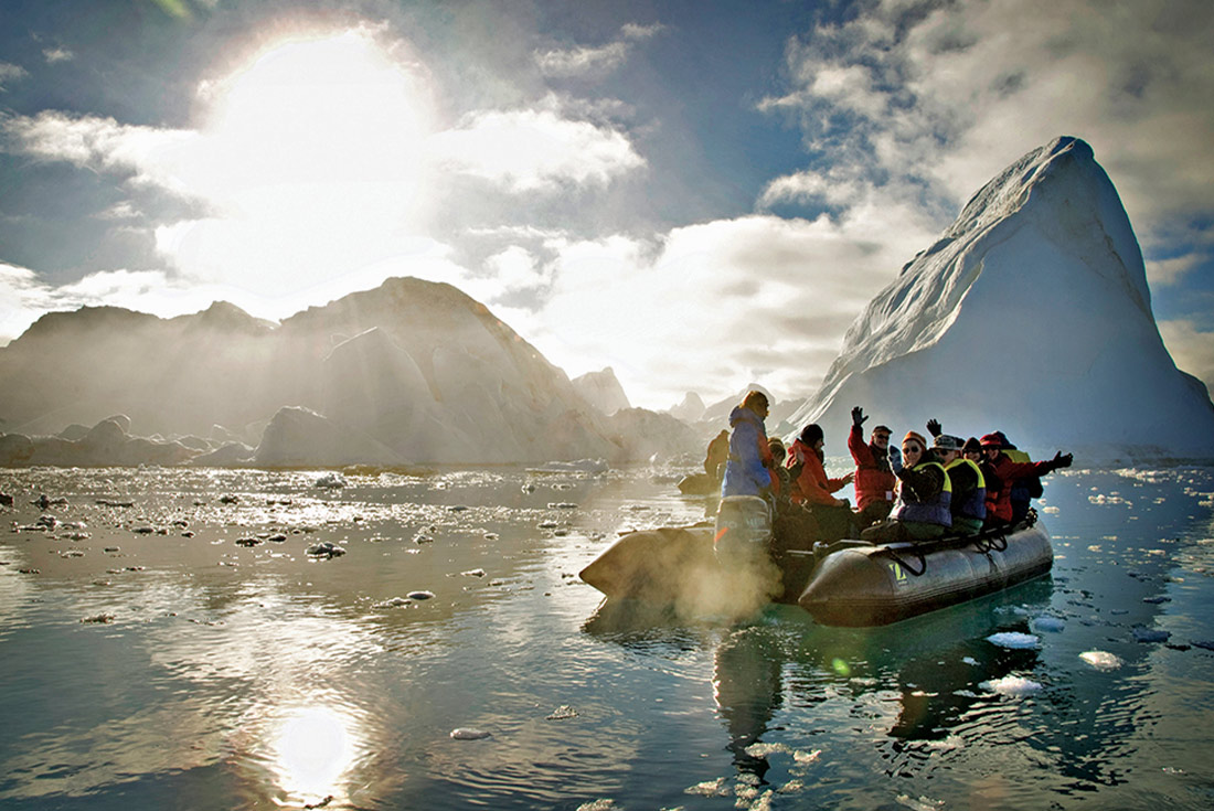 exploring icebergs via zodiac, Greenland
