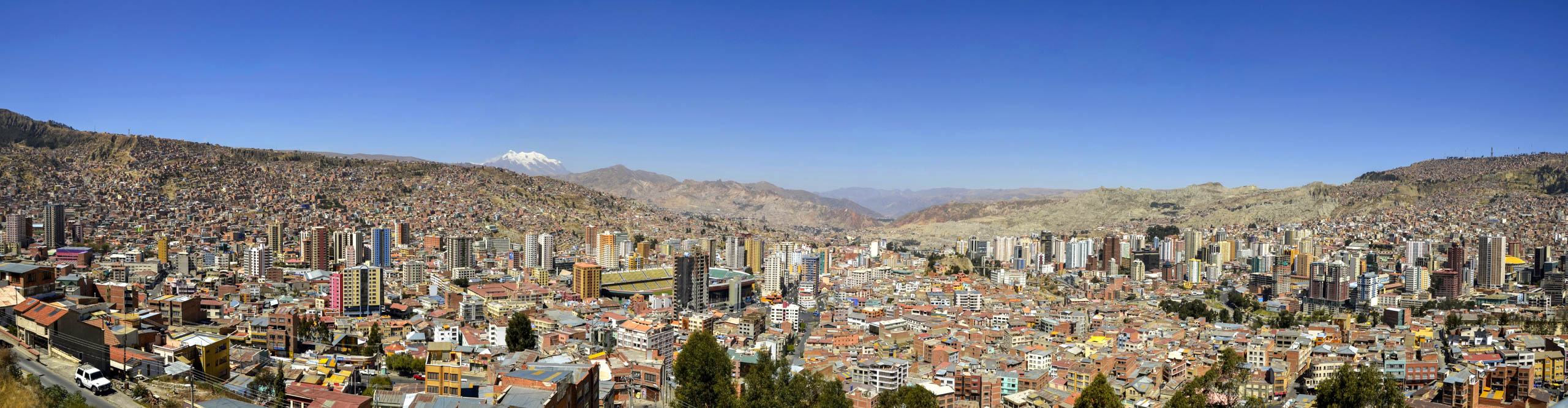 View of the skyline of La Paz and the mountains, with a clear blue sky on a sunny day, Bolivia