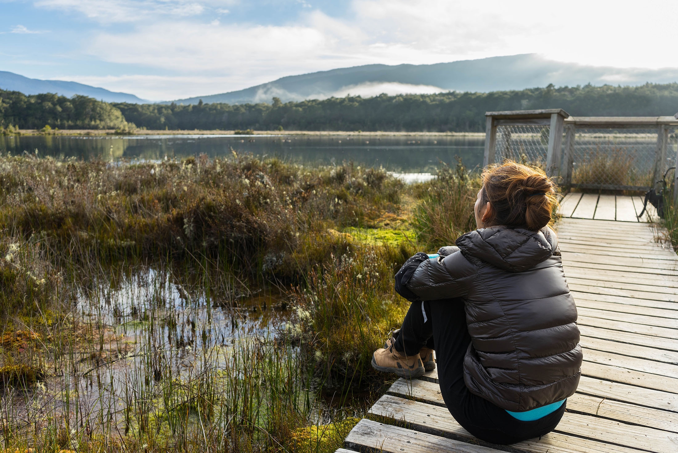 Woman taking in the views at Te Anau, New Zealand