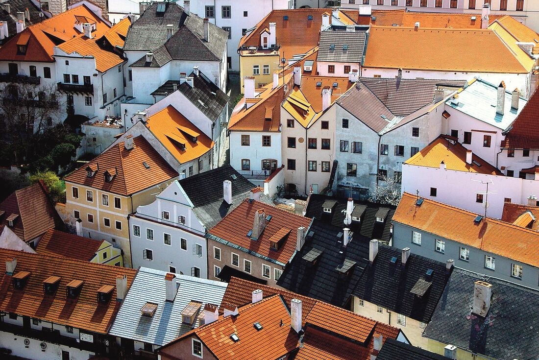 A medium aerial shot of colourful houses in Cesky Krumlov