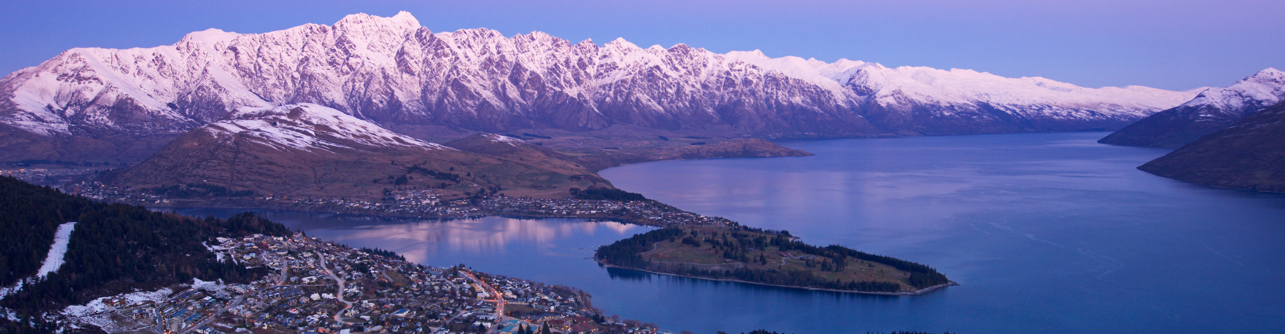 Queenstown and the snowcapped Remarkables range at sunset, New Zealand 