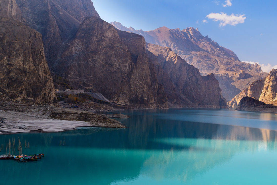 Aqua waters are surrounded by rocky landscape and mountain peaks of Pakistan