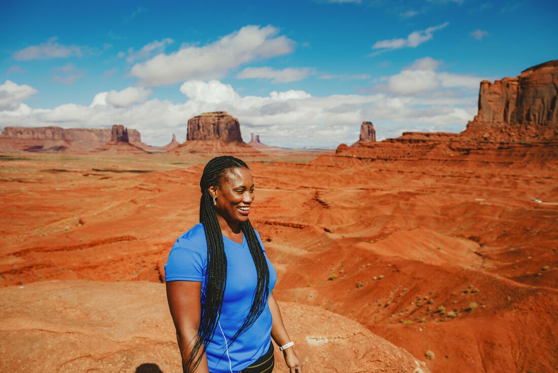 Woman in Monument Valley during a Navajo guided tour, Utah, USA
