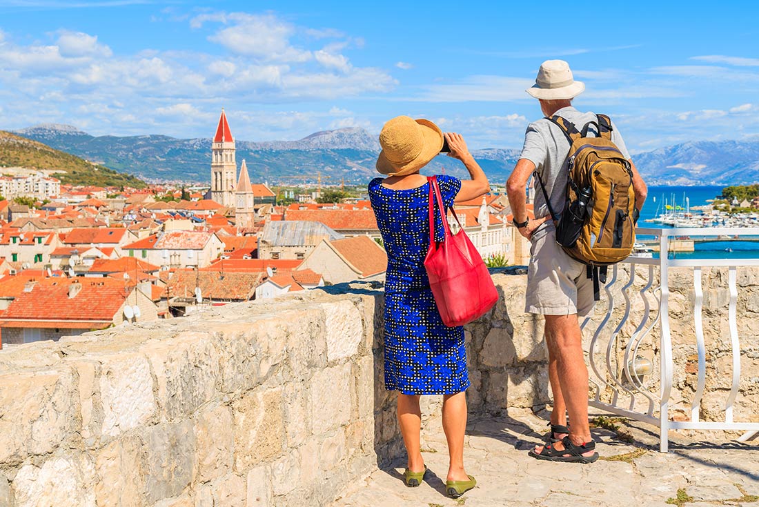 Tourists taking picturre of Trogir town, Croatia