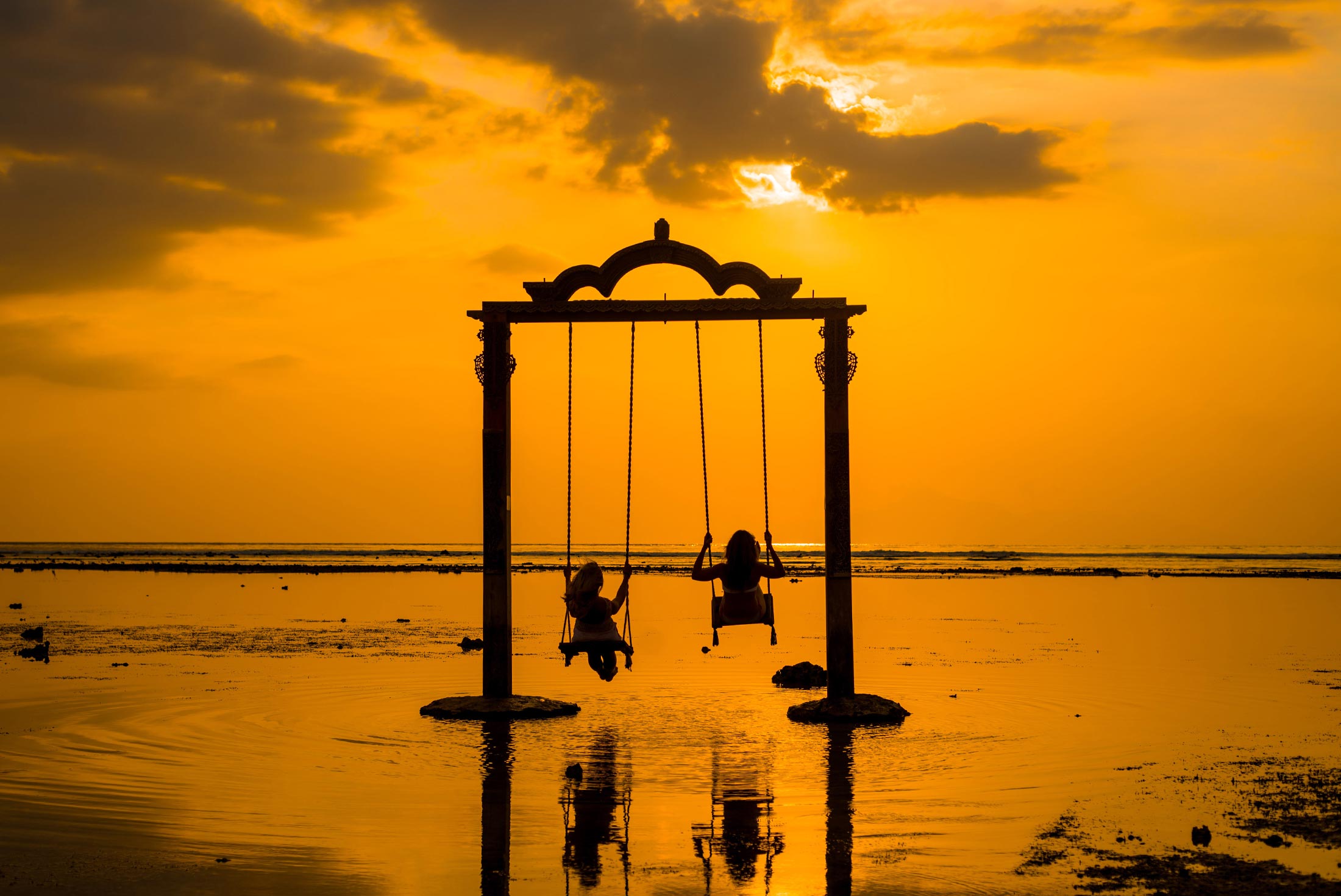 indonesia gili island trawangan girls swing sunset