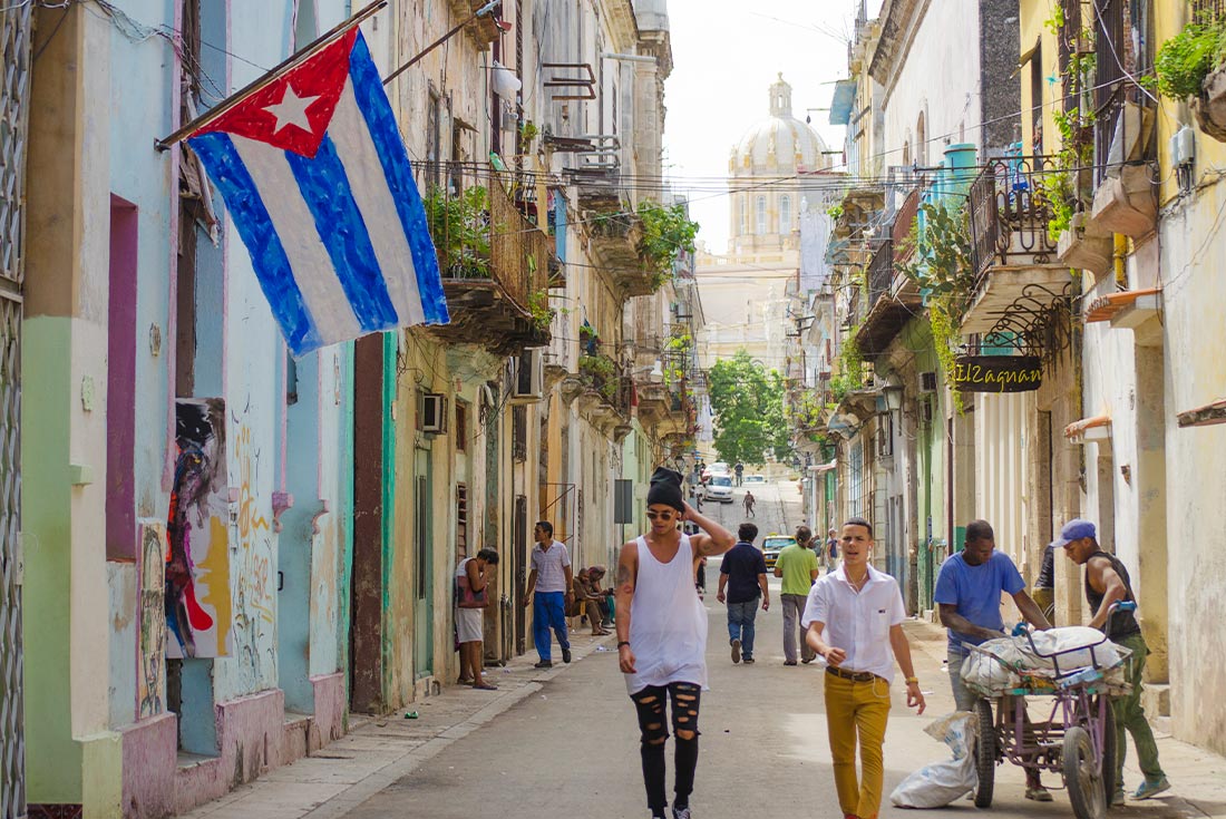 QUPC - Locals walk through the streets of Havana