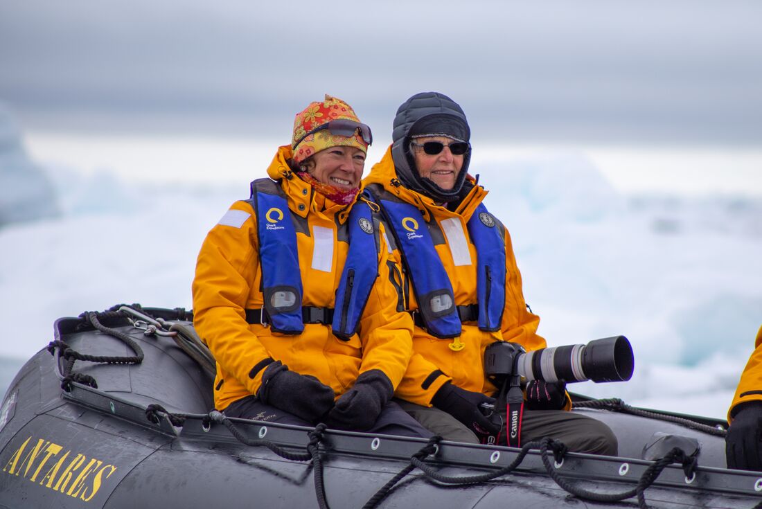 Travellers on a Zodiac boat in the Arctic