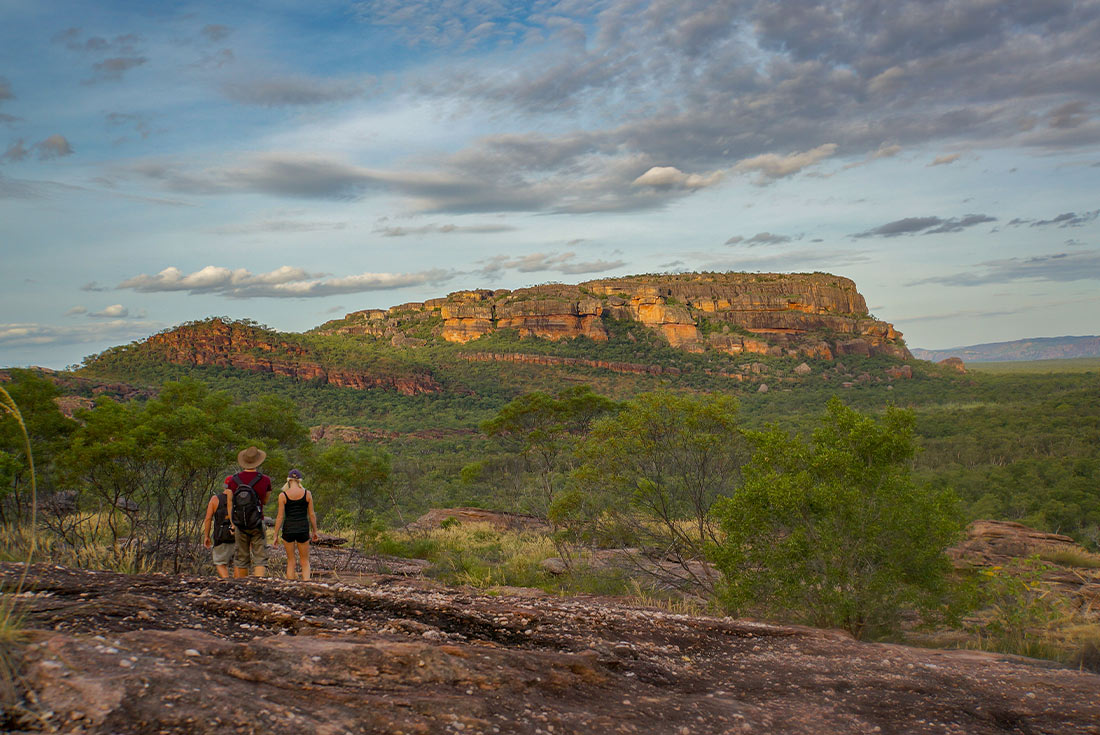 Travellers hiking through Kakadu NP towards Nadab lookout, Australia