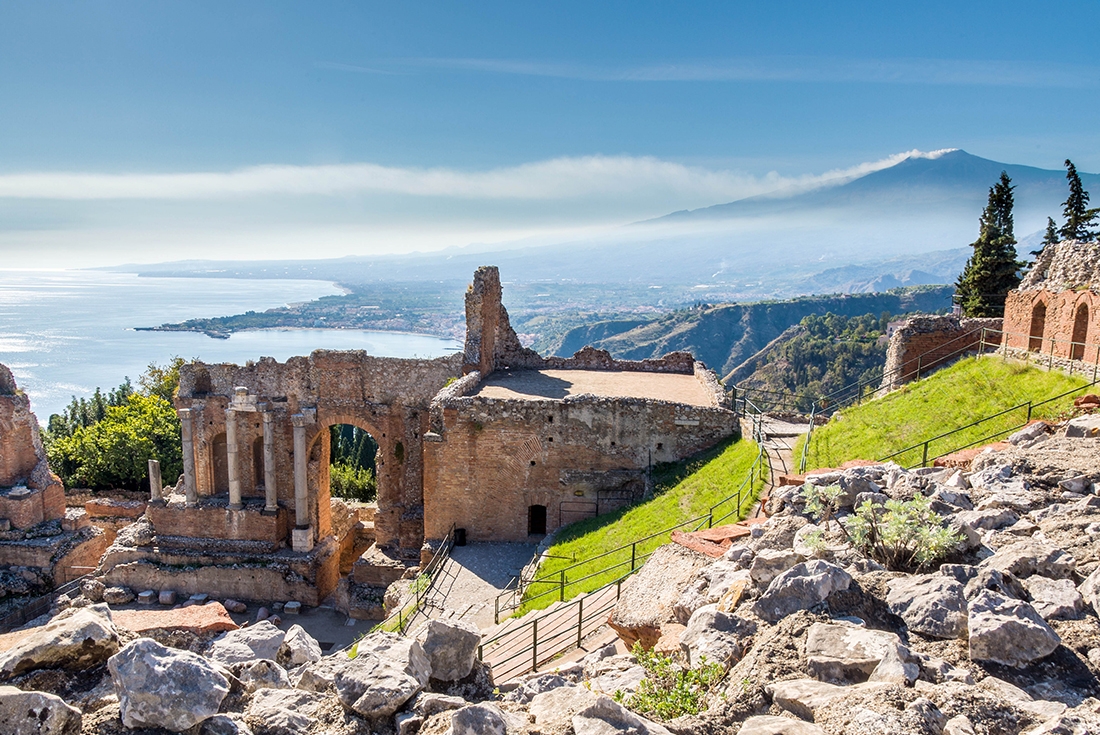 Roma ruins overlooking Taormina and Mount Etna in Italy