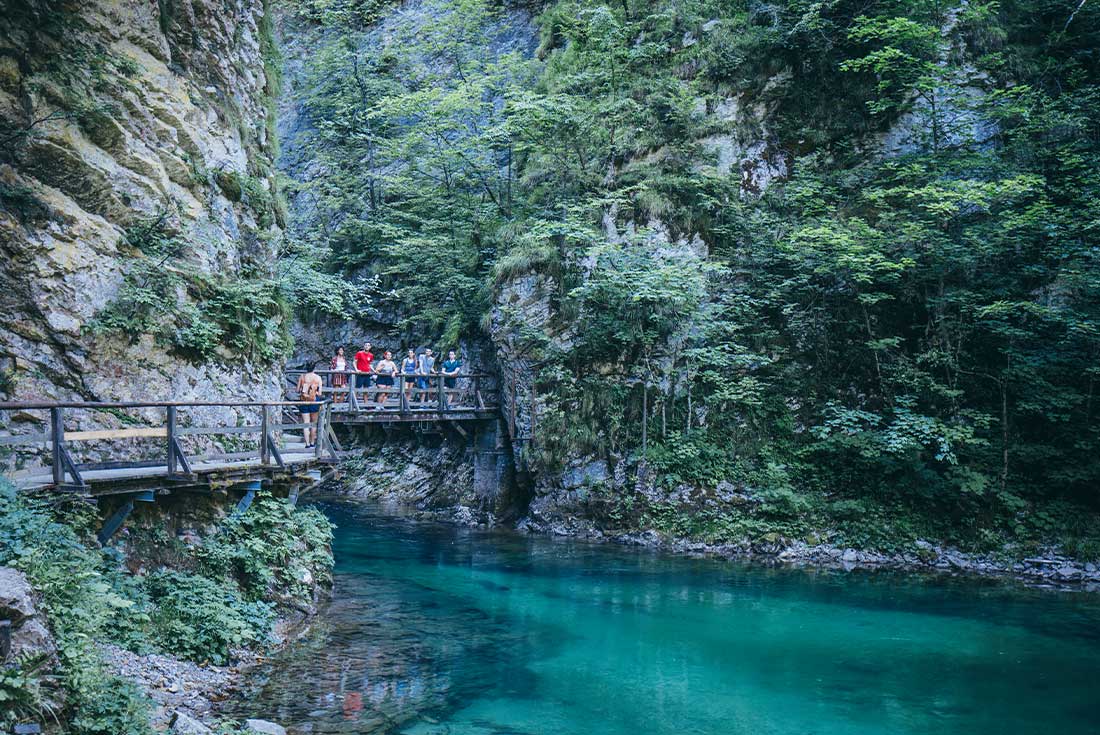 Travellers on bridge in Vintgar Gorge, Slovenia