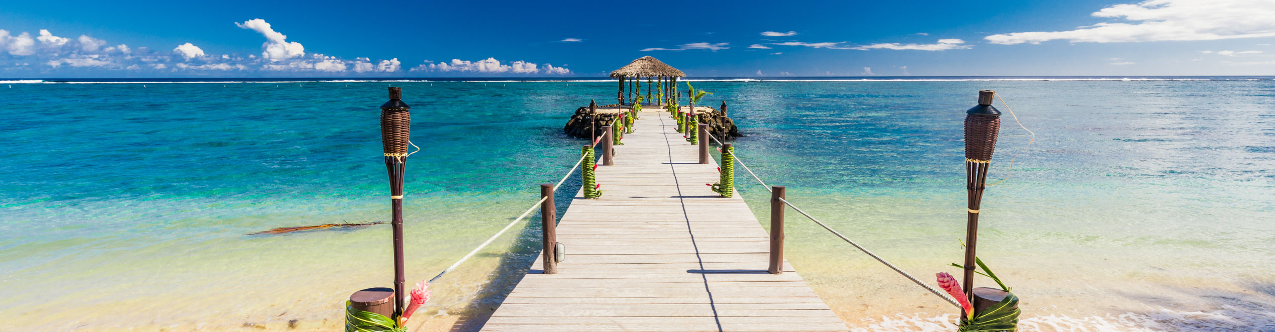 Jetty leading out into the water in Aitutaki, Samoa