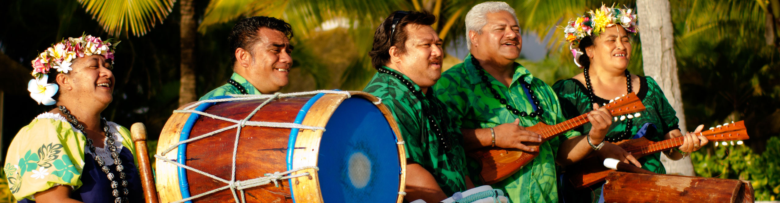 Polynesian group singing and playing instuments on stage in the Cook Islands 