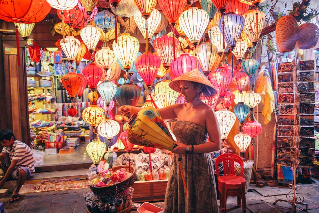 Traveller looks at lantern market in Hoi An