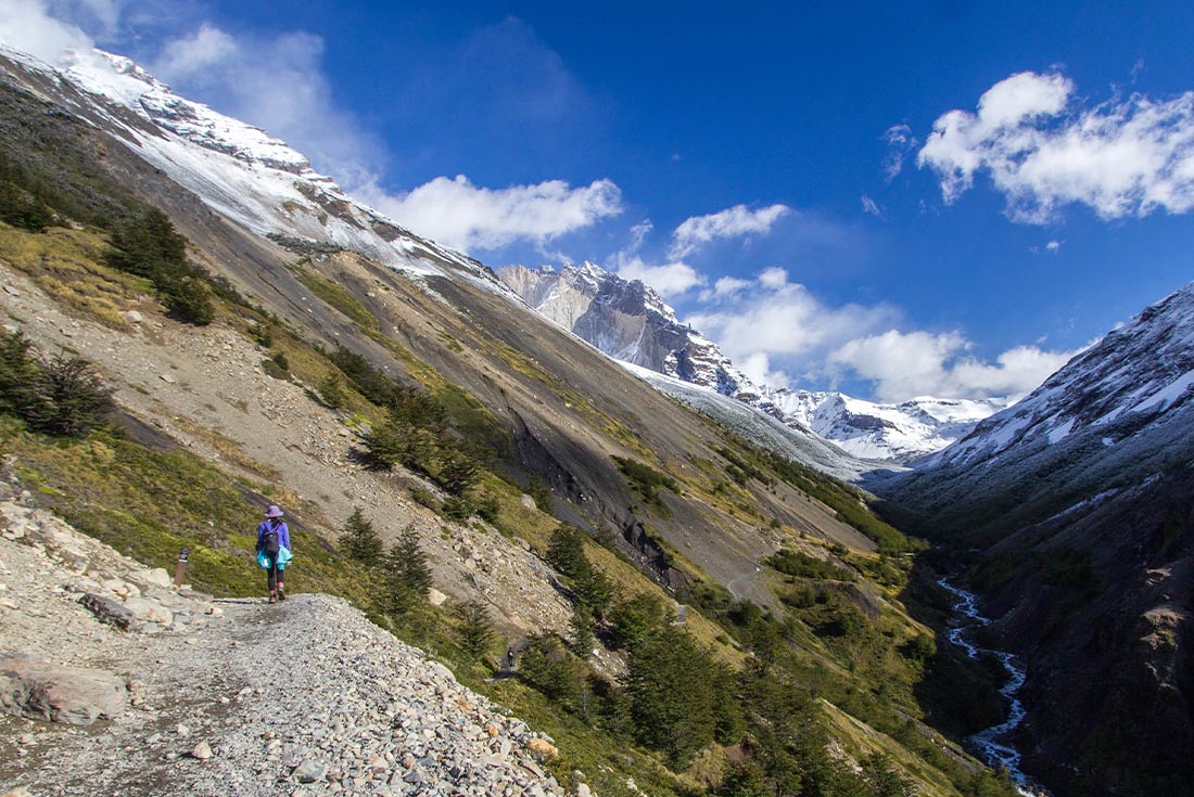 Hiker admiring the Ascencio Valley, Torres del Paine NP, Chile