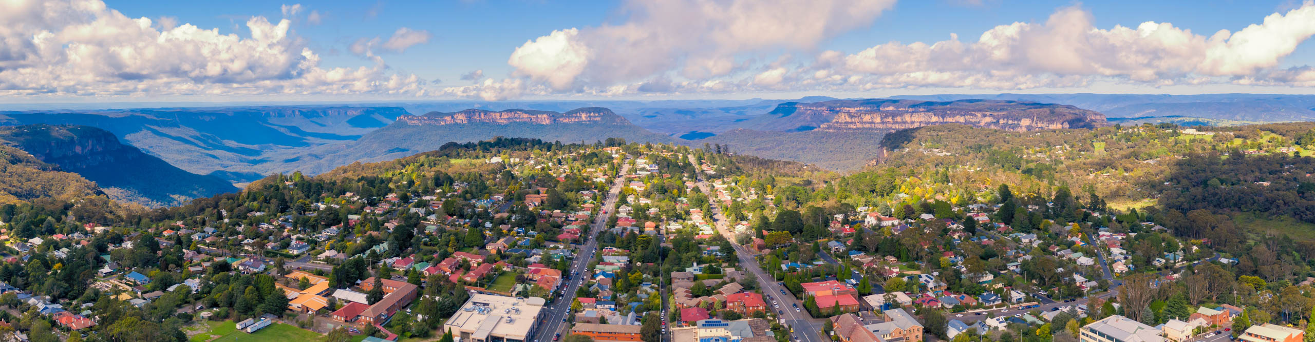 Aerial view of Katoomba as the sun rises with a few clouds in the sky, New South Wales, Australia
