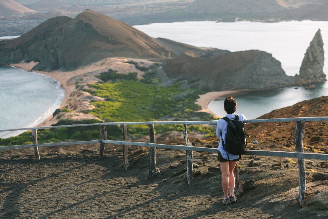 Intrepid traveller looks out over Bartolome Island in the Galapagos