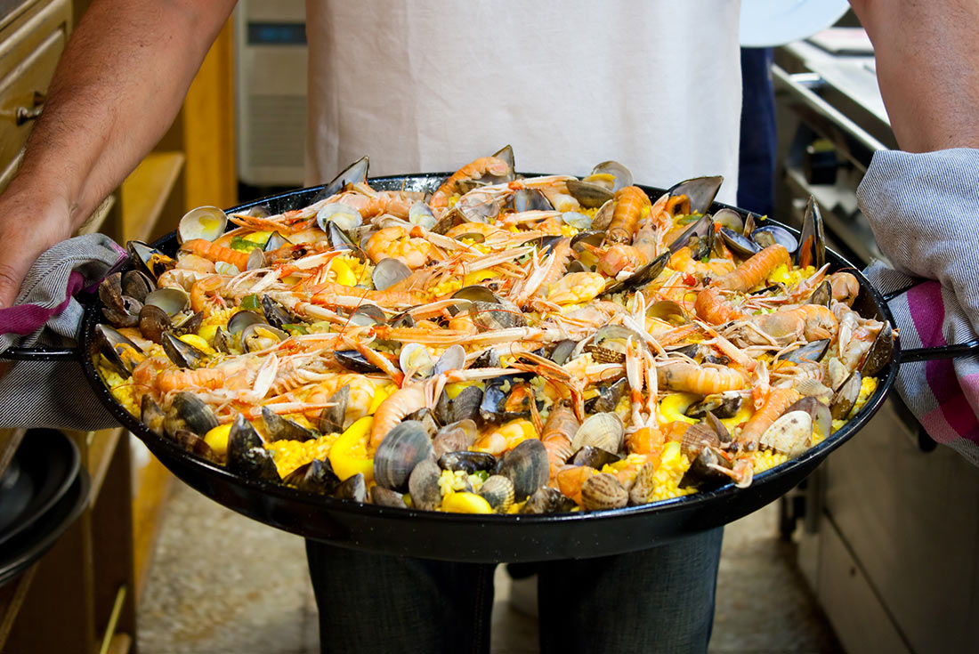 Freshly made seafood paella cooked in a basque gastronomic society in San Sebastian