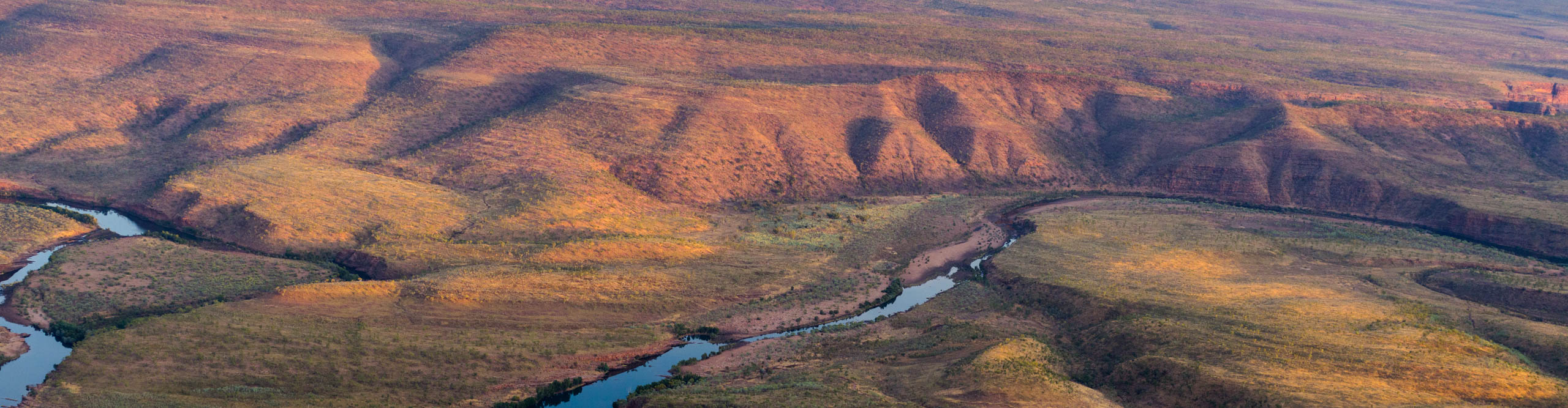  Aerial view of the Kimberleys and the El Questro river at sunset, Western Australia 