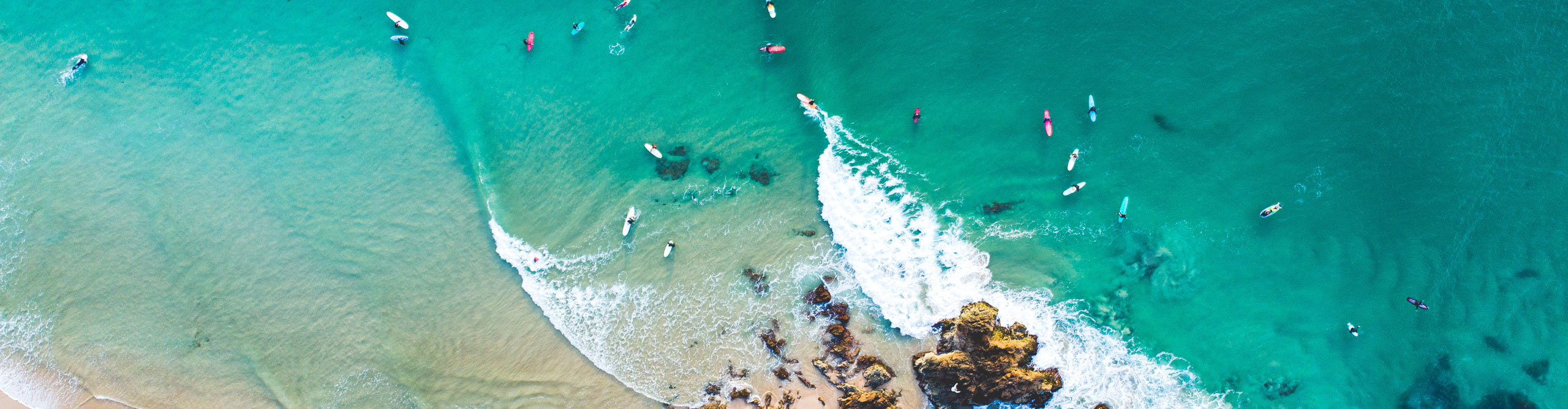Aerial view of surfers in the water in Noosa, Queensland, Australia 