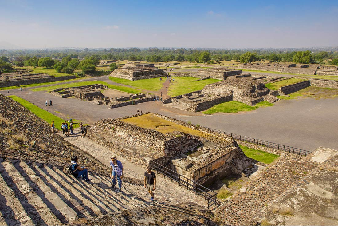QBPM - Aerial view of people climbing the steps of Teotihuacan temple in Mexico