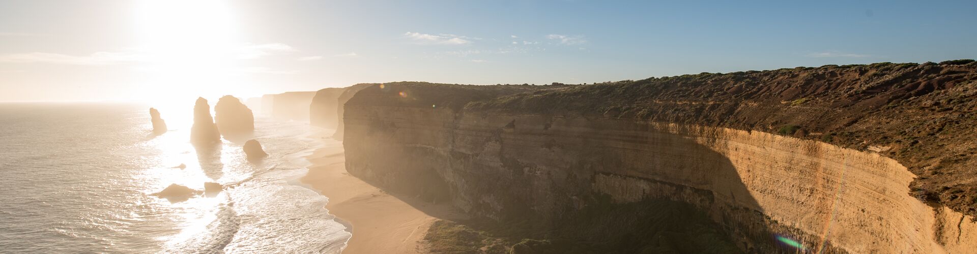 Cliffs jutting out along the coastal Great Ocean Road on a sunny day