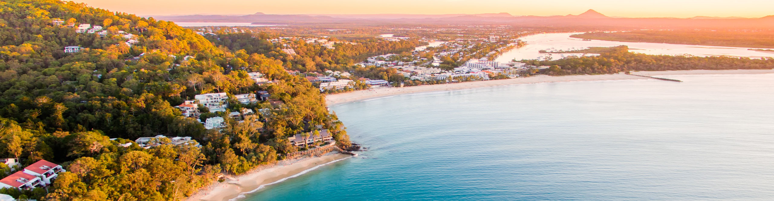 An aerial view of Noosa National Park and beach at sunset in Queensland Australia
