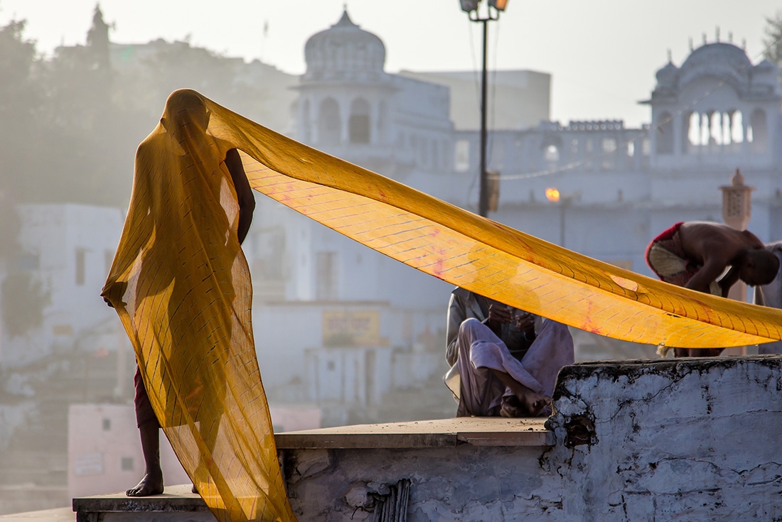 Local man with a long piece of cloth draped over him in Pushkar, India