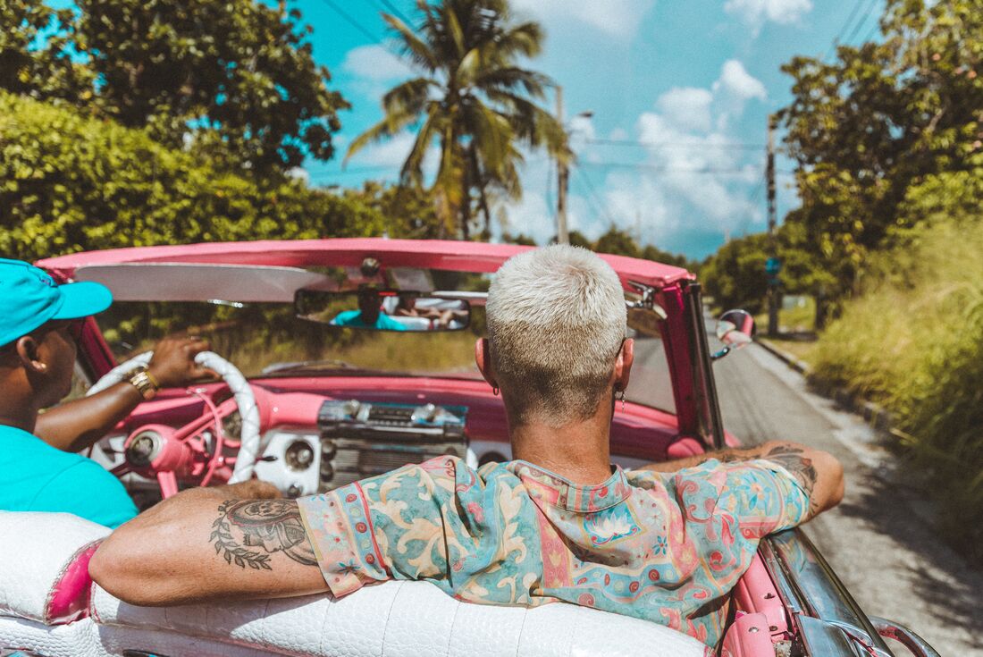 Ride in vintage pink cadillac in the outer edges of Havana, Cuba