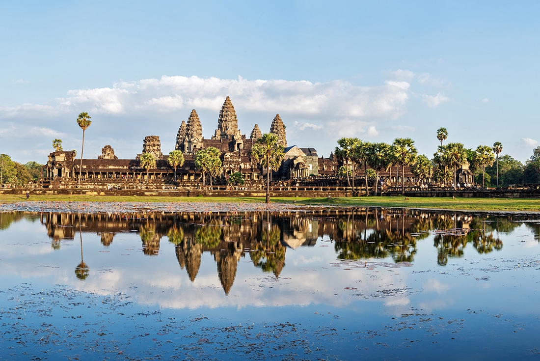 View of Angkor Wat over the lake in Cambodia on an Intrepid Travel tour.