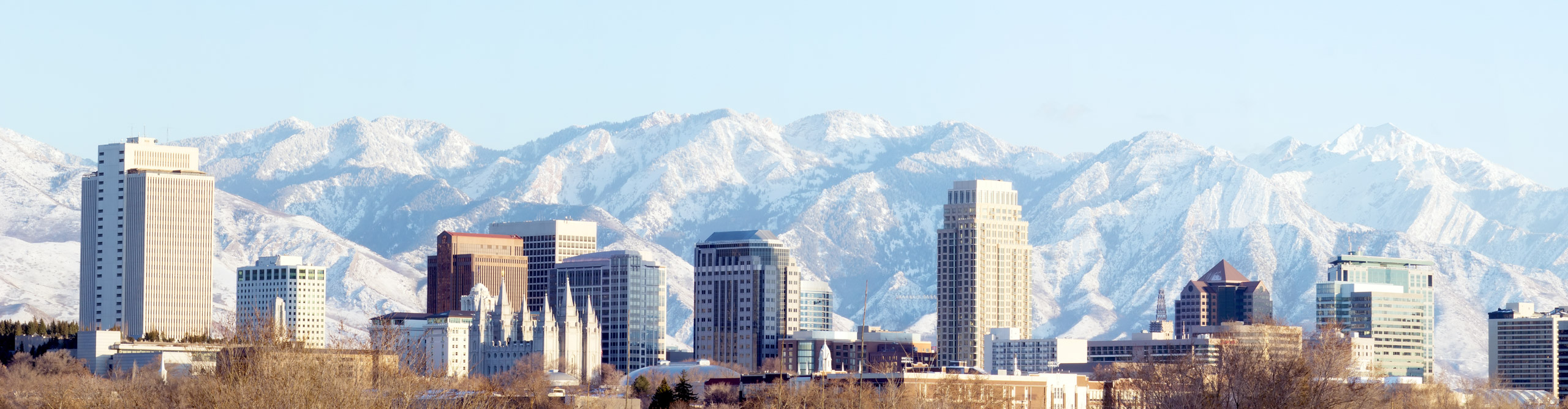 Salt Lake City with snowy mountains in the distance on a clear sunny day, Utah, USA